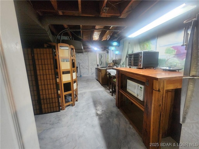 159 Tonka Shady Ln, Camdenton, MO 65020 - basement with freestanding refrigerator