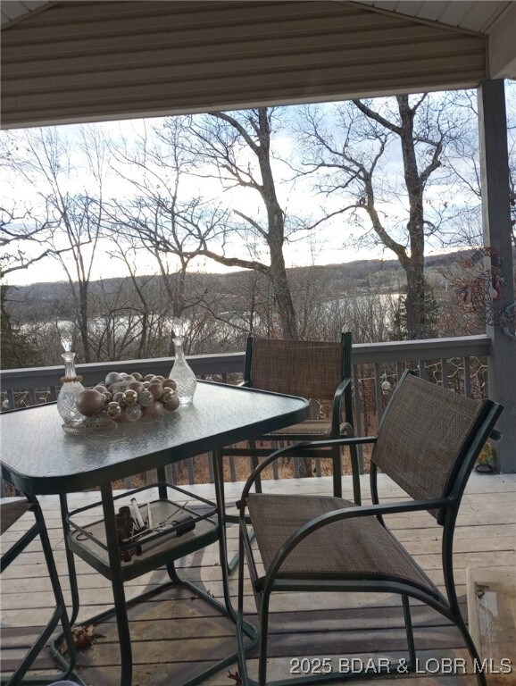 159 Tonka Shady Ln, Camdenton, MO 65020 - wooden terrace with outdoor dining area
