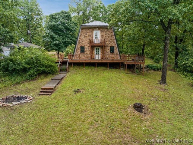75 Central Hill Rd, Eldon, MO 65026 - back of property featuring a fire pit, a deck, a yard, and stairs