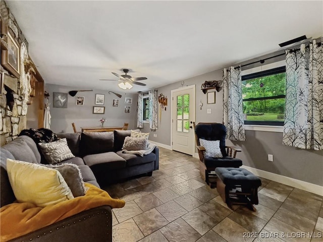 75 Central Hill Rd, Eldon, MO 65026 - living area featuring a ceiling fan, baseboards, and stone tile flooring