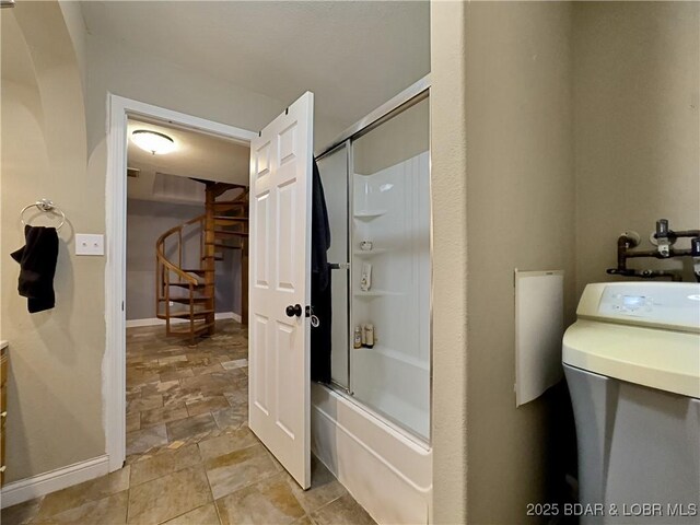 75 Central Hill Rd, Eldon, MO 65026 - full bath with stone finish floors, enclosed tub / shower combo, baseboards, and vanity