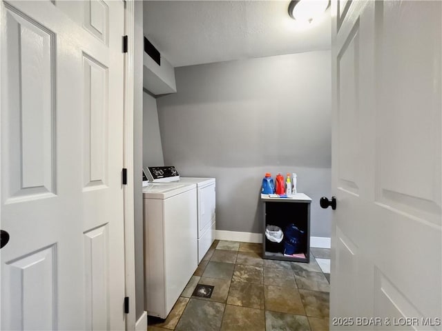 75 Central Hill Rd, Eldon, MO 65026 - washroom with washer and dryer, baseboards, and dark stone finish flooring