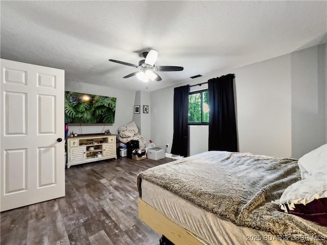 75 Central Hill Rd, Eldon, MO 65026 - bedroom with dark wood-style floors and a ceiling fan