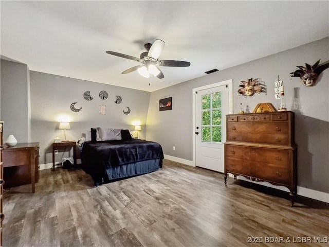 75 Central Hill Rd, Eldon, MO 65026 - bedroom featuring wood finished floors, baseboards, and ceiling fan