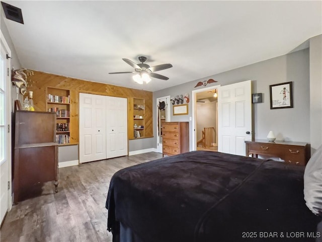 75 Central Hill Rd, Eldon, MO 65026 - bedroom featuring wood finished floors, a closet, and a ceiling fan