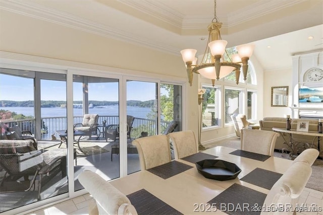 549 Cedar Rd, Lake Ozark, MO 65049 - tiled dining area featuring a water view, a chandelier, a raised ceiling, and crown molding