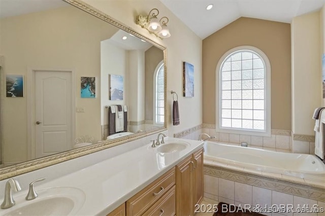 549 Cedar Rd, Lake Ozark, MO 65049 - full bath featuring a bath, lofted ceiling, and double vanity
