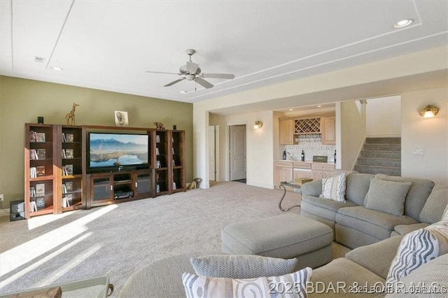 549 Cedar Rd, Lake Ozark, MO 65049 - carpeted living room with bar area, stairs, recessed lighting, and a ceiling fan