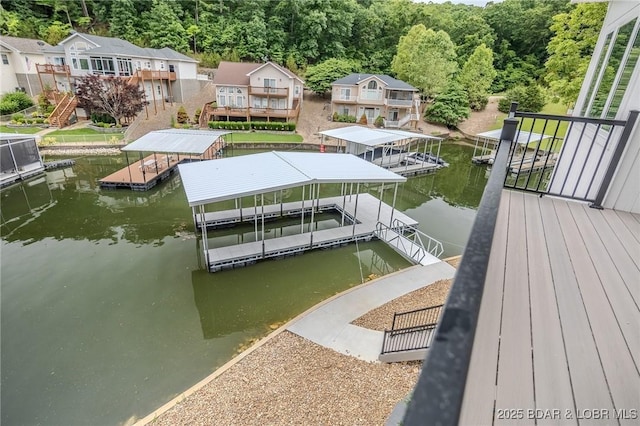 80 Ledgestone Estates Ct, Sunrise Beach, MO 65079 - dock featuring a water view, boat lift, and a view of trees