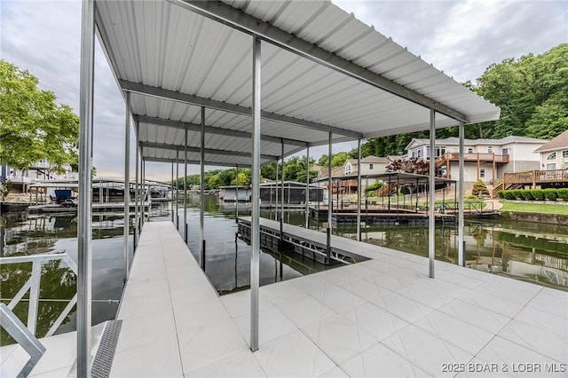 80 Ledgestone Estates Ct, Sunrise Beach, MO 65079 - dock featuring boat lift and a water view