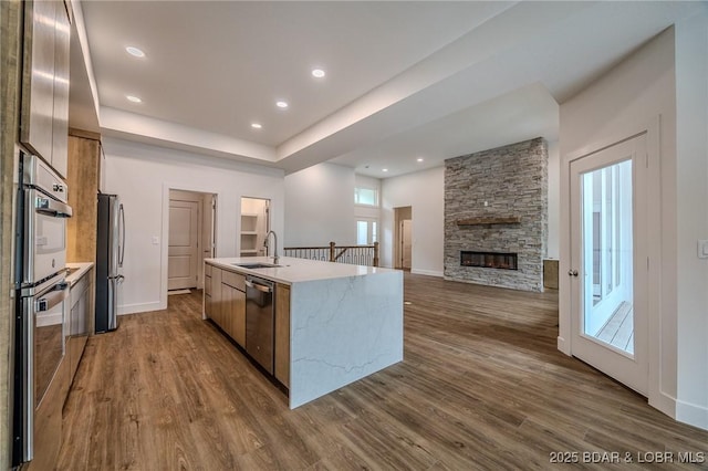 80 Ledgestone Estates Ct, Sunrise Beach, MO 65079 - kitchen with dark wood-type flooring, modern cabinets, a kitchen island with sink, and recessed lighting