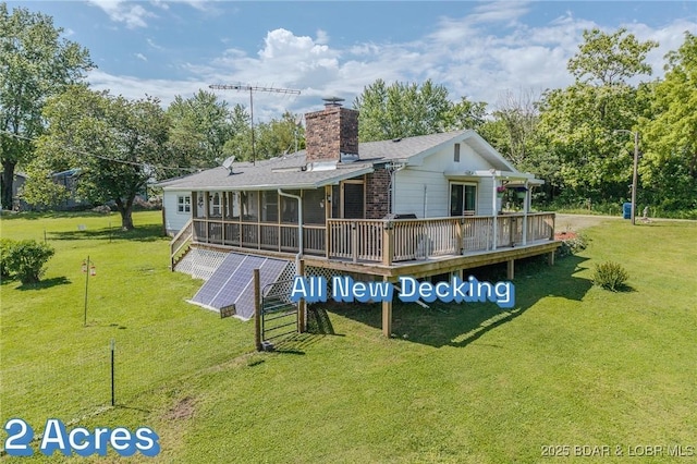15852 Kindling Rd, Eldridge, MO 65463 - back of house featuring a wooden deck, a chimney, and a yard