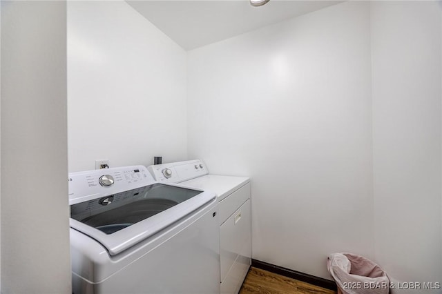 15852 Kindling Rd, Eldridge, MO 65463 - washroom featuring independent washer and dryer and dark wood-style flooring