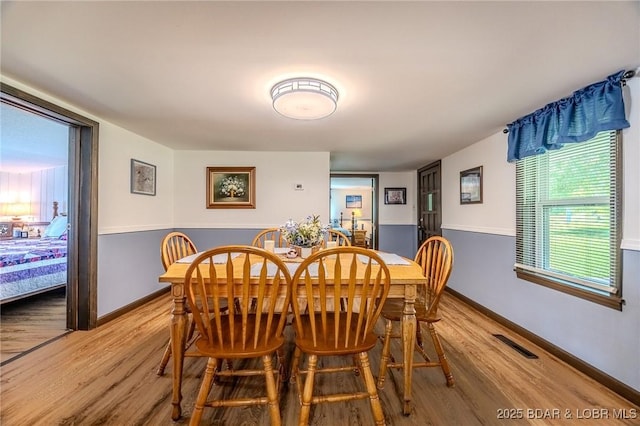15852 Kindling Rd, Eldridge, MO 65463 - dining space with wood finished floors and baseboards