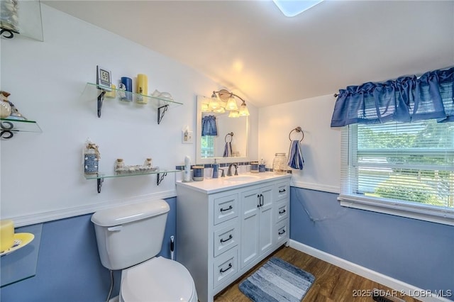 15852 Kindling Rd, Eldridge, MO 65463 - bathroom with toilet, vanity, wood finished floors, and lofted ceiling