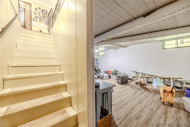 15852 Kindling Rd, Eldridge, MO 65463 - staircase featuring wood finished floors and concrete block wall