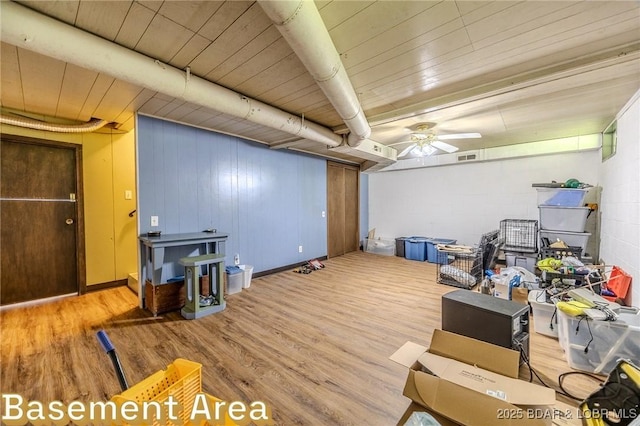15852 Kindling Rd, Eldridge, MO 65463 - living area featuring wood finished floors, a ceiling fan, concrete block wall, and wooden ceiling
