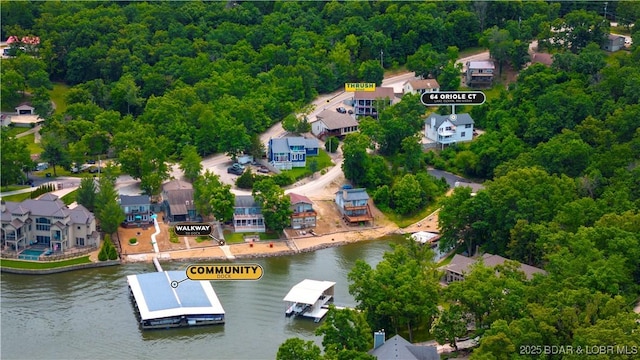 64 Oriole Ct, Lake Ozark, MO 65049 - aerial perspective of suburban area featuring a nearby body of water and a heavily wooded area