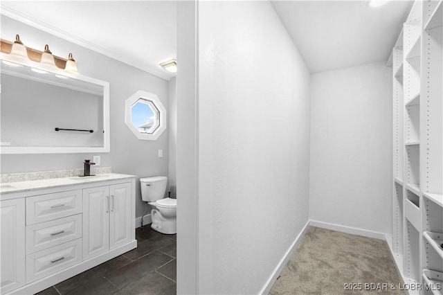 64 Oriole Ct, Lake Ozark, MO 65049 - full bath featuring double vanity, toilet, baseboards, and crown molding