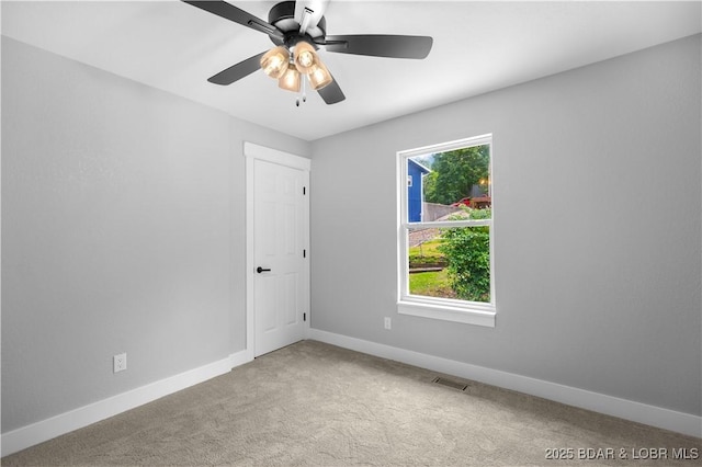 64 Oriole Ct, Lake Ozark, MO 65049 - spare room with baseboards, carpet, and ceiling fan