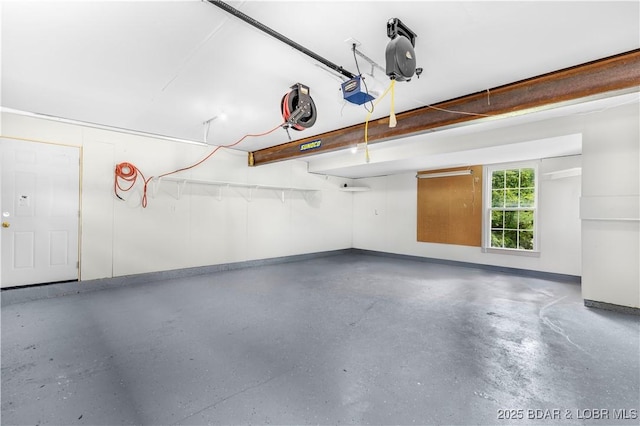 64 Oriole Ct, Lake Ozark, MO 65049 - garage with baseboards and a garage door opener