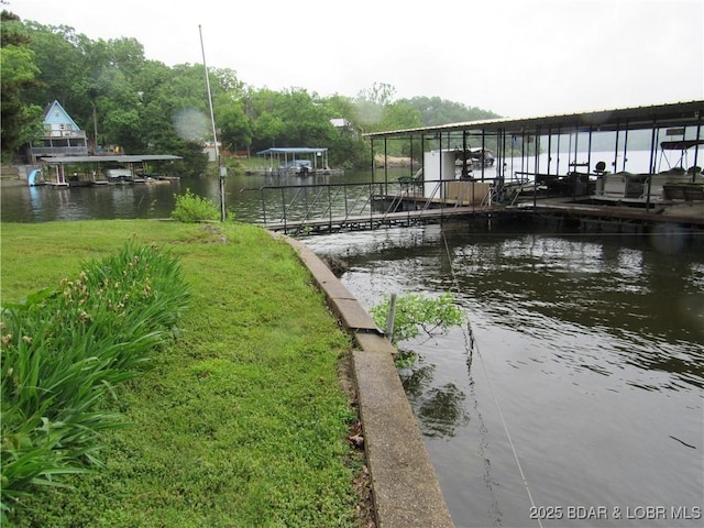 dock featuring a water view and boat lift