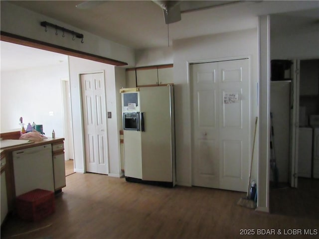 kitchen featuring white fridge with ice dispenser and wood finished floors