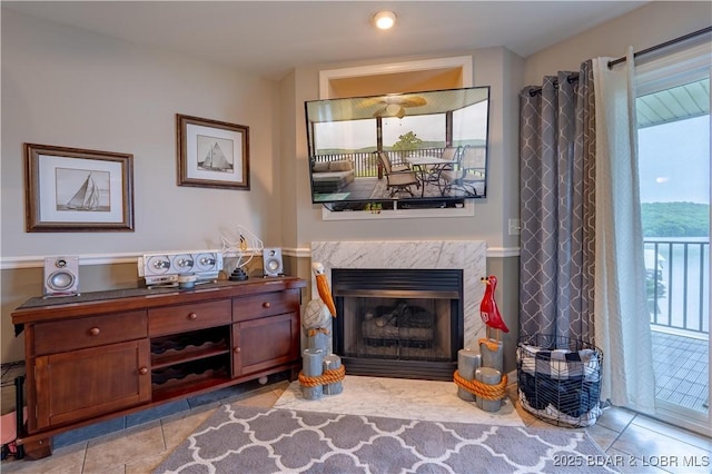549 Park Place Dr Unit 2D, Kaiser, MO 65047 - sitting room featuring light tile patterned floors and a premium fireplace