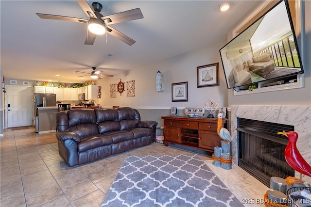 549 Park Place Dr Unit 2D, Kaiser, MO 65047 - living area with ceiling fan, light tile patterned floors, a high end fireplace, and recessed lighting