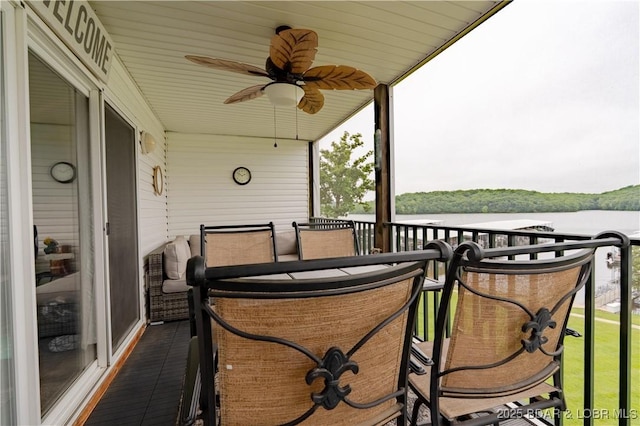549 Park Place Dr Unit 2D, Kaiser, MO 65047 - view of patio / terrace featuring ceiling fan, a balcony, and a water view