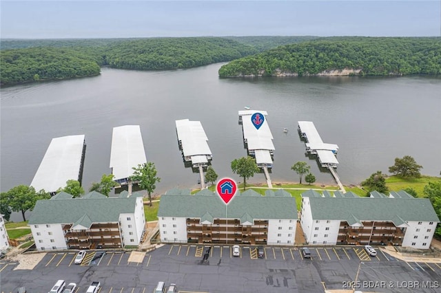 549 Park Place Dr Unit 2D, Kaiser, MO 65047 - drone / aerial view of a heavily wooded area and a nearby body of water