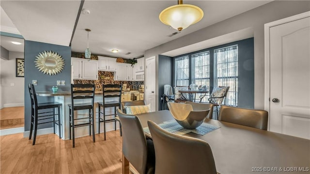 101 Circle Edge Unit 20-3A, Lake Ozark, MO 65049 - dining area featuring light wood-style floors and baseboards