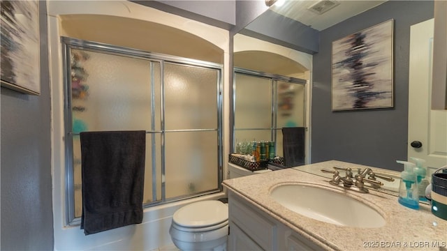 101 Circle Edge Unit 20-3A, Lake Ozark, MO 65049 - full bathroom with vanity, toilet, and bath / shower combo with glass door