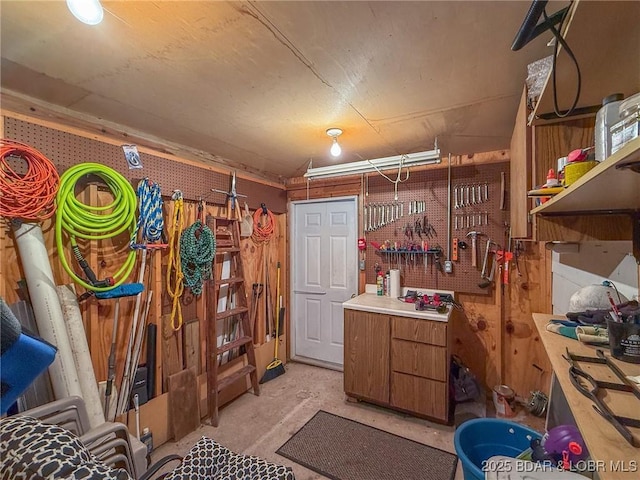 88 Hendrix Haven Dr, Sunrise Beach, MO 65079 - miscellaneous room with a workshop area and unfinished concrete floors
