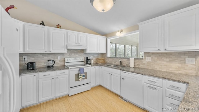 88 Hendrix Haven Dr, Sunrise Beach, MO 65079 - kitchen with white appliances, under cabinet range hood, a sink, lofted ceiling, and light stone countertops
