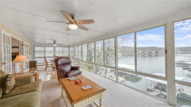 88 Hendrix Haven Dr, Sunrise Beach, MO 65079 - sunroom / solarium with a wall of windows and a water view