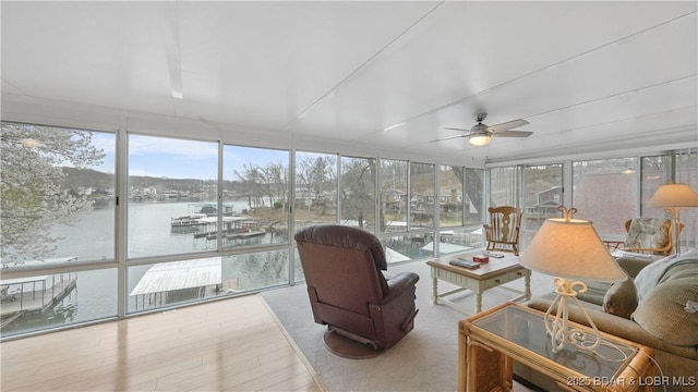 88 Hendrix Haven Dr, Sunrise Beach, MO 65079 - sunroom / solarium with healthy amount of natural light, wood finished floors, a water view, and expansive windows