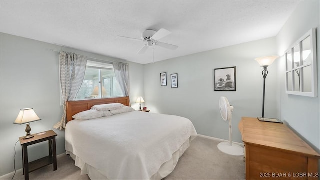 88 Hendrix Haven Dr, Sunrise Beach, MO 65079 - bedroom featuring light carpet, baseboards, a ceiling fan, and a textured ceiling