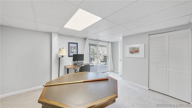 88 Hendrix Haven Dr, Sunrise Beach, MO 65079 - home office featuring a paneled ceiling, carpet floors, and baseboards