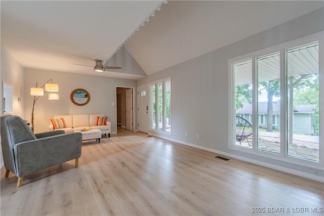 1556 Mockingbird Ln, Osage Beach, MO 65065 - living area featuring light wood finished floors, baseboards, vaulted ceiling, and ceiling fan