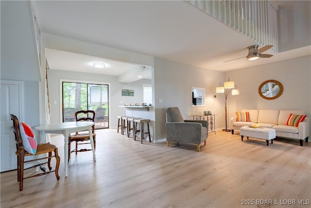 1556 Mockingbird Ln, Osage Beach, MO 65065 - living room with light wood-style flooring, a ceiling fan, and baseboards