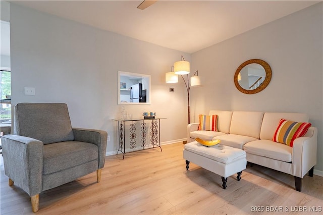 1556 Mockingbird Ln, Osage Beach, MO 65065 - living area featuring light wood-style flooring and baseboards