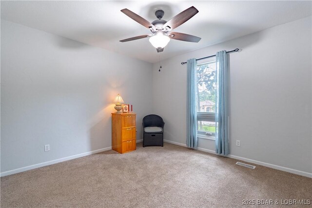 1556 Mockingbird Ln, Osage Beach, MO 65065 - empty room with ceiling fan, plenty of natural light, light colored carpet, and baseboards