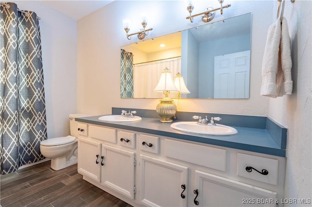 1556 Mockingbird Ln, Osage Beach, MO 65065 - full bathroom featuring double vanity, wood finished floors, toilet, and curtained shower