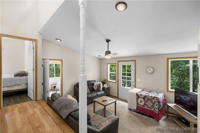 29825 Button Wood Ln, Rocky Mount, MO 65072 - living area with healthy amount of natural light, lofted ceiling, and wood finished floors
