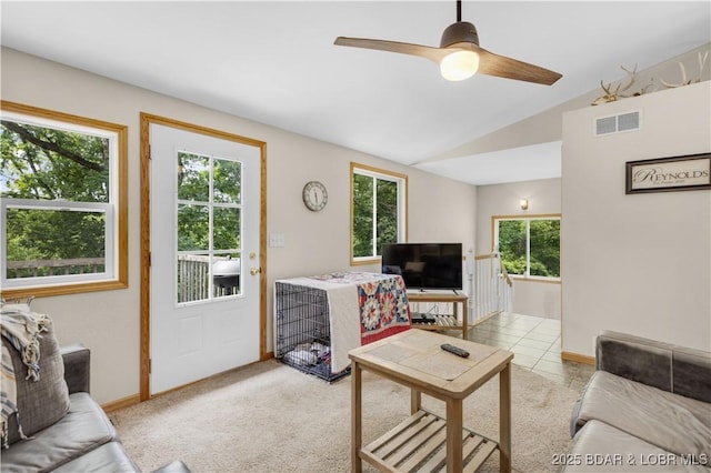 29825 Button Wood Ln, Rocky Mount, MO 65072 - living room featuring healthy amount of natural light, lofted ceiling, a ceiling fan, and baseboards