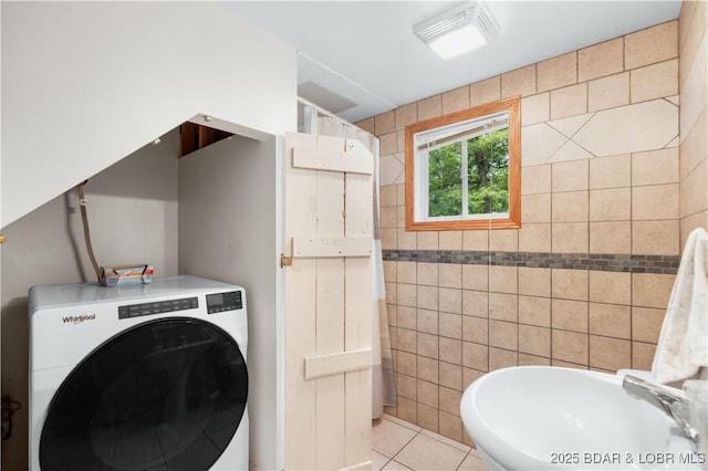 29825 Button Wood Ln, Rocky Mount, MO 65072 - bathroom with washer / dryer, a sink, and tile patterned flooring