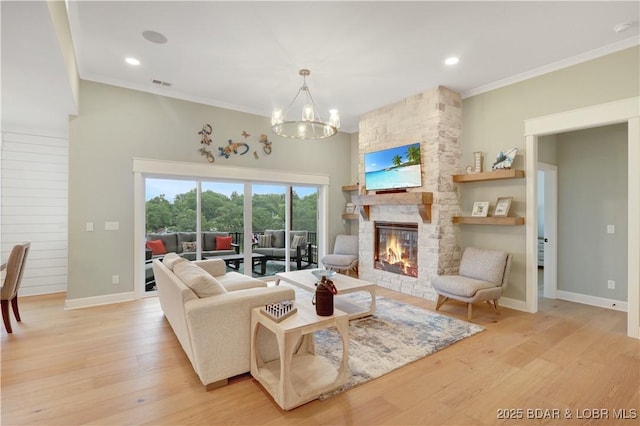 152 Pearl Ln, Climax Springs, MO 65324 - living area featuring ornamental molding, a fireplace, light wood finished floors, a chandelier, and baseboards