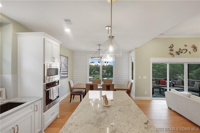 152 Pearl Ln, Climax Springs, MO 65324 - kitchen featuring appliances with stainless steel finishes, plenty of natural light, light wood-style floors, and recessed lighting