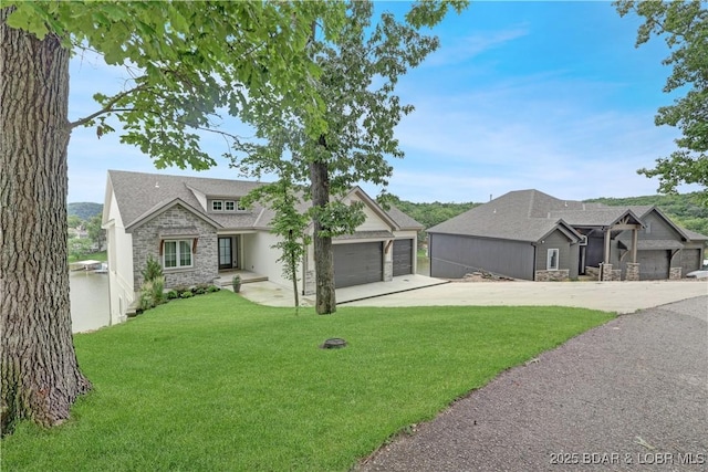 152 Pearl Ln, Climax Springs, MO 65324 - view of front of house with stone siding, driveway, a garage, a front lawn, and a shingled roof